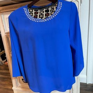 Bright blue 3/4 sleeve asymmetrical hem polyester top with pearl neck accents
